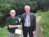 Tommy McGrath competition secretary of Moyola Angling Association presents a cheque for �1240 to John Barry of Cancer Research UK Castledawson branch
